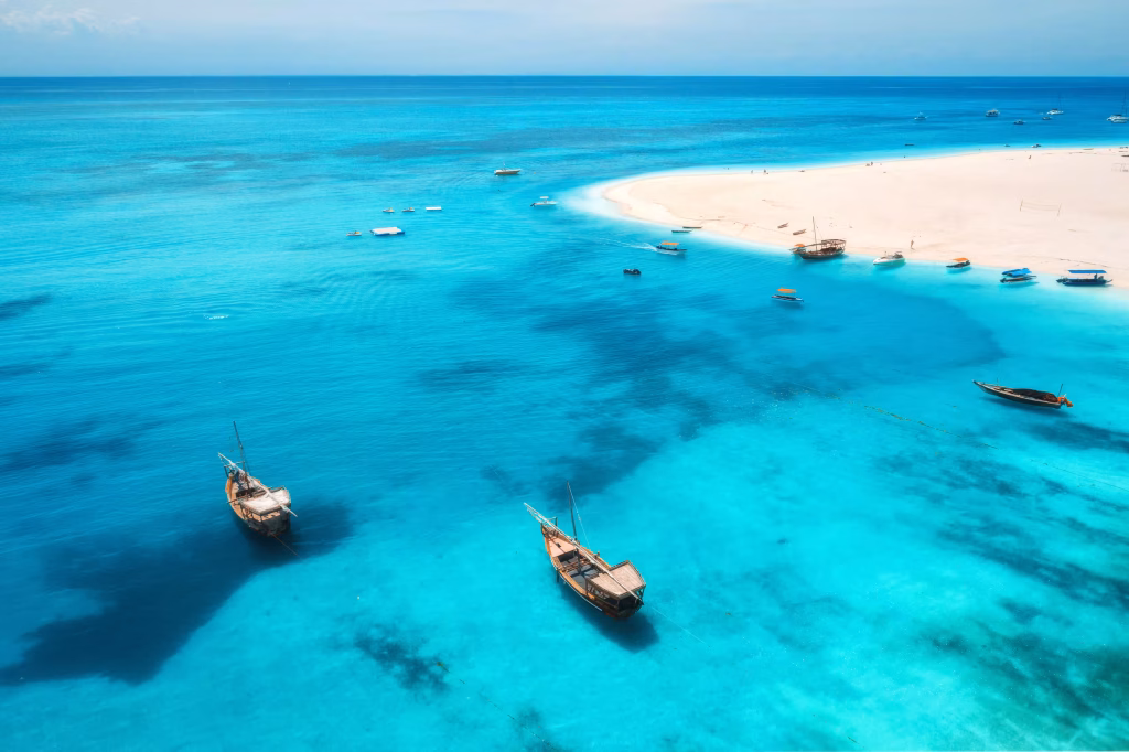 aerial-view-of-boats-on-tropical-sea-coast-with-sa-2024-12-01-16-59-37-utc